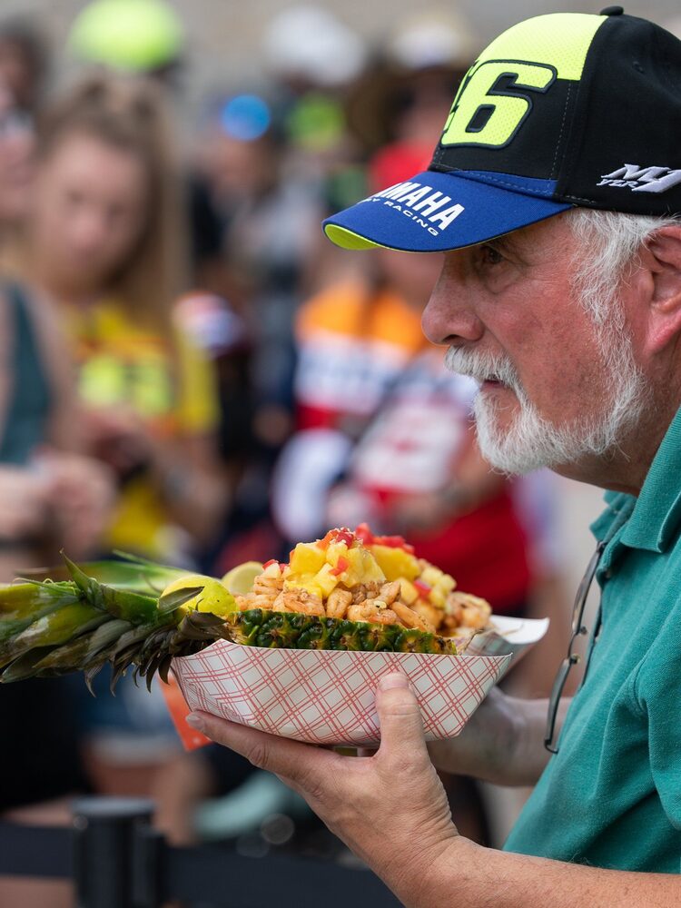 Fans with pineapple bowls on race weekend